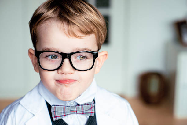 istock Child professor wears glasses and makes a face 1329044220
