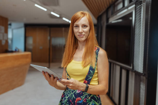 istock Portrait of creative employee in office, using digital tablet for business 1329045353