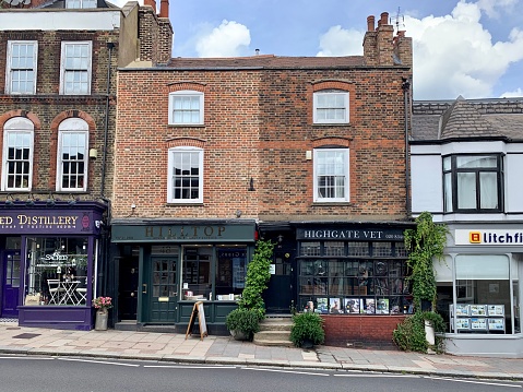 Street view of Highgate High street. Fragment of facade of local small shops. North of London