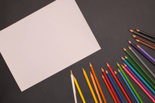 istock Multi colored pencils And white paper Back to school and education concept 1329047783