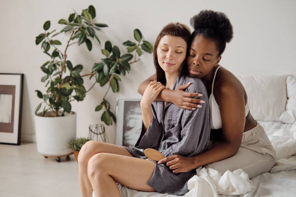 istock African young woman embracing her girlfriend 1329048911