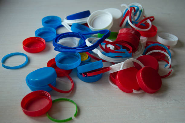 istock Heap of plastic bottle cups 1329050600