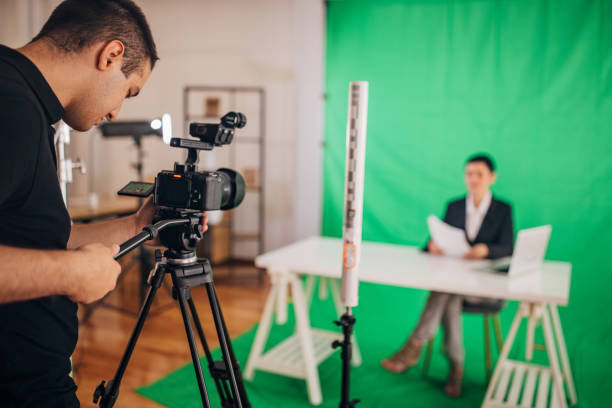 istock Woman anchor reading news in studio 1329052790