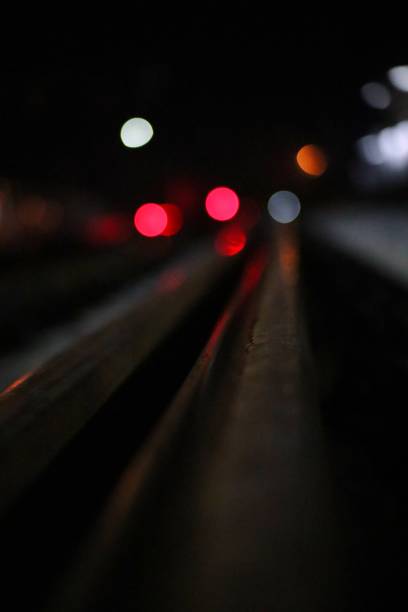 istock railroad tracks with city lights 1329054351
