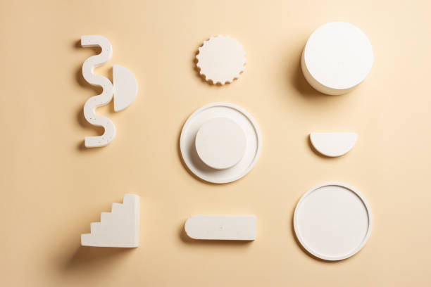 istock Composition of plaster decorations of different geometries on a delicate background 1329055951