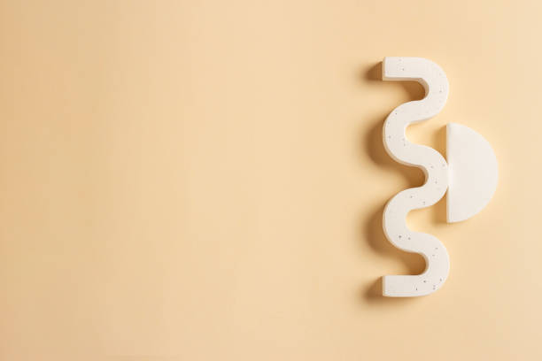 istock Composition of plaster decorations of different geometries on a delicate background 1329055996