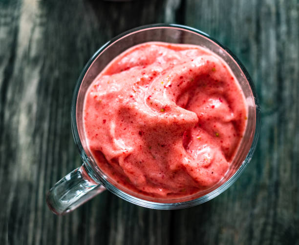 istock Strawberry ice cream on wooden background 1329062383