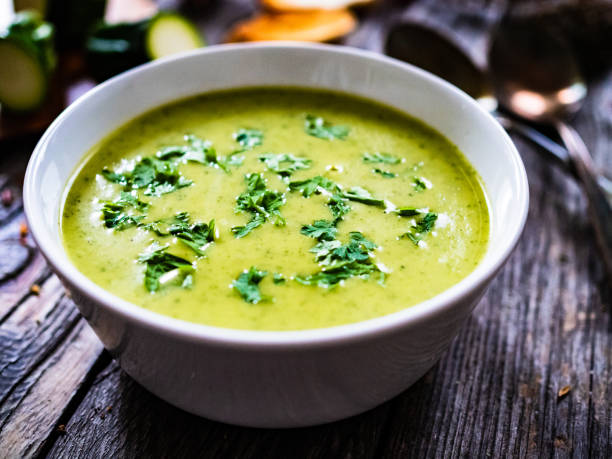 istock Cream zucchini soup on wooden table 1329062993