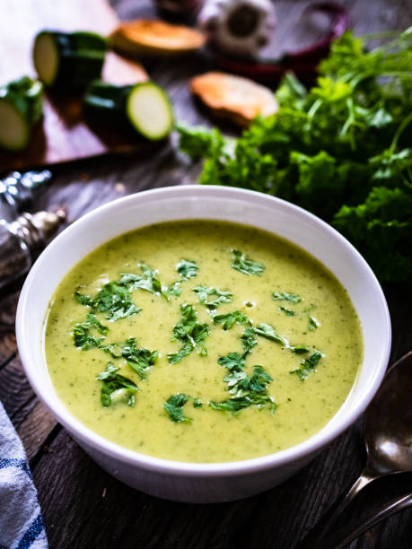 istock Cream zucchini soup on wooden table 1329063010