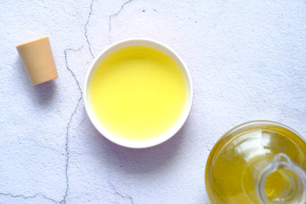 istock olive oil in a small container on table , top view 1329064112
