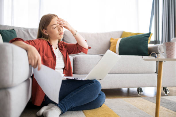 istock Tired young woman working at home. 1329065257