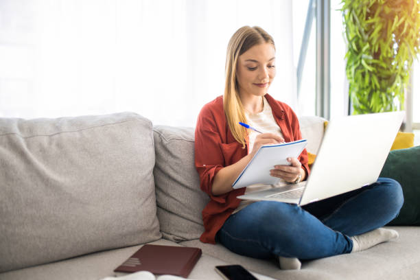 istock Young female university student studying at home. 1329065311