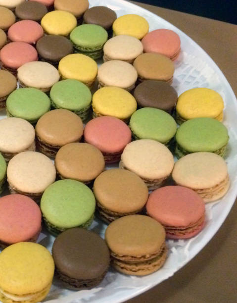 Colorful Macaron cookies on plate stock photo