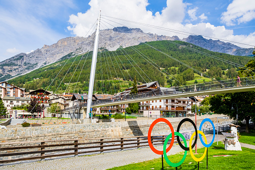 The five-ringed symbol of the Olympic Games placed on the bank of the river Adda in Bormio remembers that the city will be one of the locations of the 2026 Winter Olympics, officially known as the XXV Olympic Winter Games.