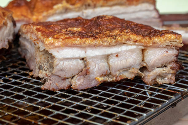 istock CRISPY PORK BELLY - Freshly cooked Roast Pork, on an iron tray. 1329067784