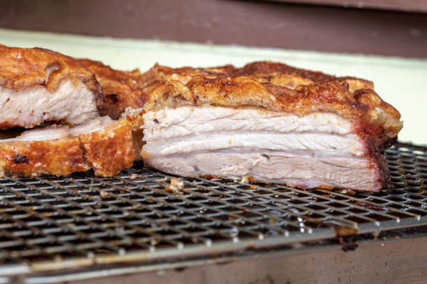 istock CRISPY PORK BELLY - Freshly cooked Roast Pork, on an iron tray. 1329067787
