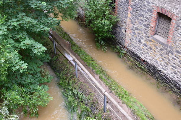 istock small path flooded by the Elz in July 2021 and forming a second river bed 1329068305