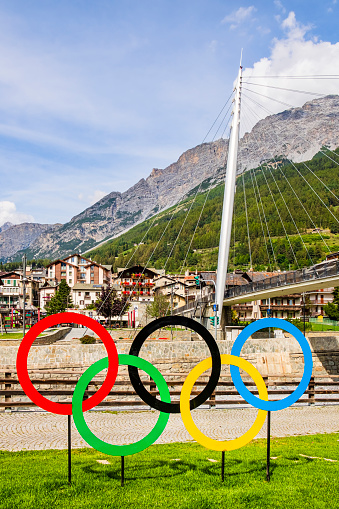 The five-ringed symbol of the Olympic Games placed on the bank of the river Adda in Bormio remembers that the city will be one of the locations of the 2026 Winter Olympics, officially known as the XXV Olympic Winter Games.
