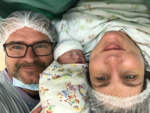 First photo of the parents with the baby after delivery.