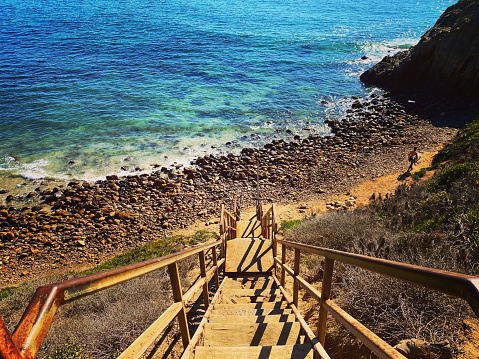 Stairs, beach, ocean, clear water