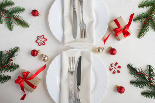 istock Christmas table setting on the beige tablecloth. Top view. Close-up. 1329075656