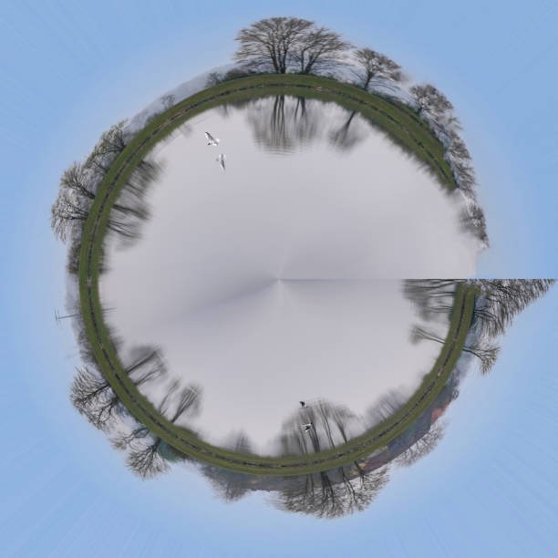 istock Abstract panoramic aerial view in a forest and field with fantastic beautiful clouds and curvature of space like a small planet 1329075749