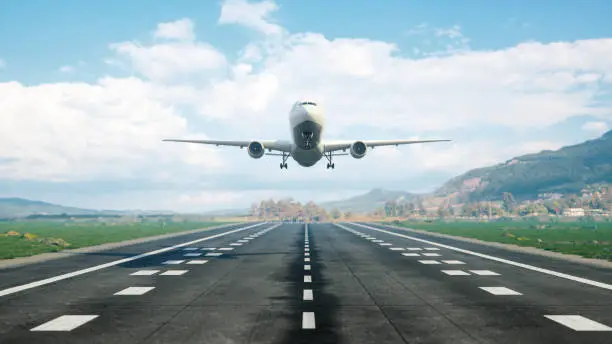 Landing of the passenger plane to the runway.