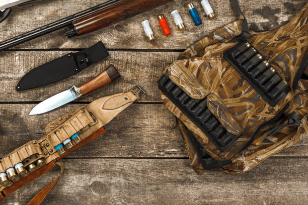 istock Hunting equipment on old dark wooden background 1329077993