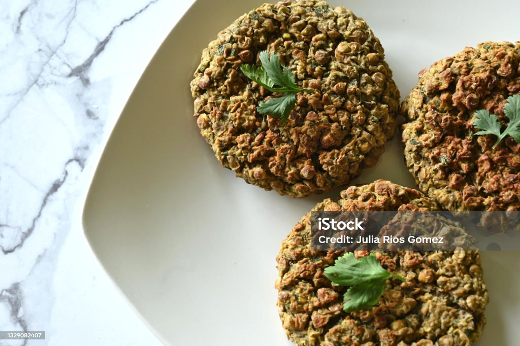 Vegetable hamburgers. Concepto alternative food Close-up of lentil burgers on white plate on marble table, with copy space Balance Stock Photo