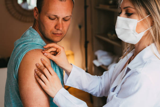 istock Man sitting and having an acupuncture treatment on his shoulder 1329082455