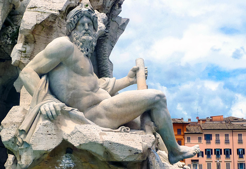 Statue of god Zeus in Bernini Fountain of Four Rivers in Piazza Navona, Rome, Italy