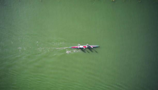 istock Two athletes sculling through the rowing canal 1329094118