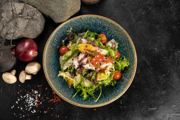 istock Salad with octopus and fresh vegetables 1329094269