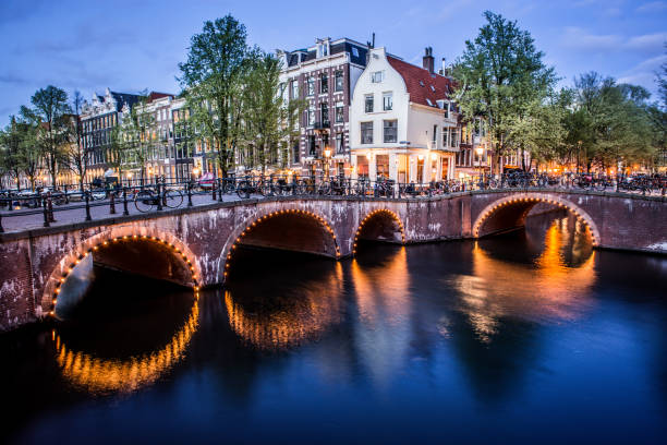 istock Bridge Full Of Bicycles In Amsterdam, The Netherlands 1329095178