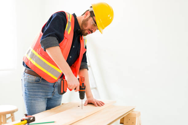 istock Contractor with protective gear cutting wood 1329096158