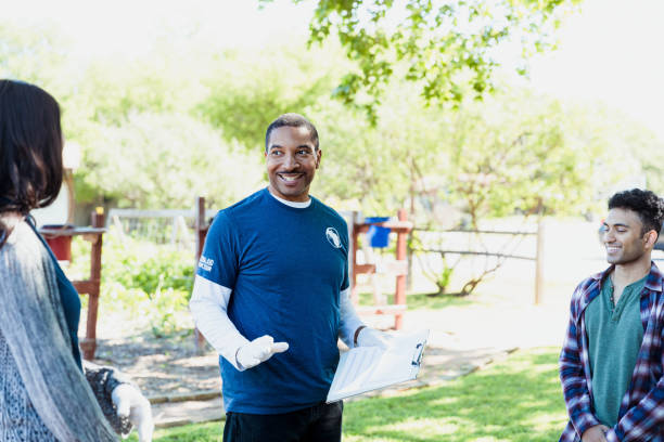 istock Male volunteer begins day's work in community garden 1329101889