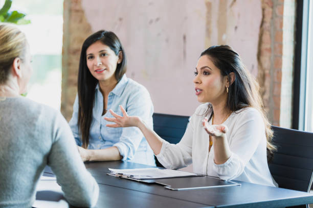istock Female CEOs have discussion in conference room 1329102058