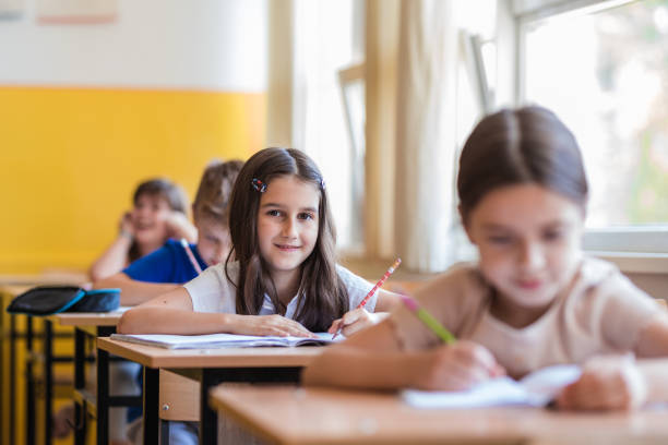 istock Joyful young girl at school 1329102076