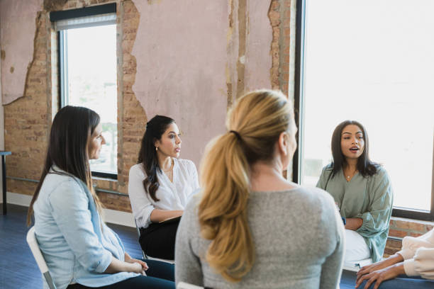 istock Five women meet as part of focus group 1329102201
