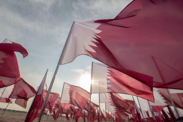 Qatar National Flag Qatar Flag waving on Qatar National Day qatar flag stock pictures, royalty-free photos & images