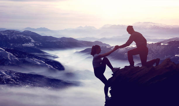 istock Man helping his friend 1329102450
