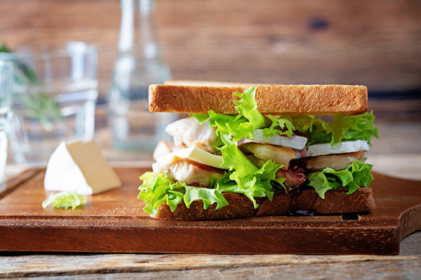 istock Chicken Brie cheese sandwich on the plate 1329103354
