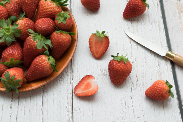 istock Strawberry close-up on a white wooden table 1329104248