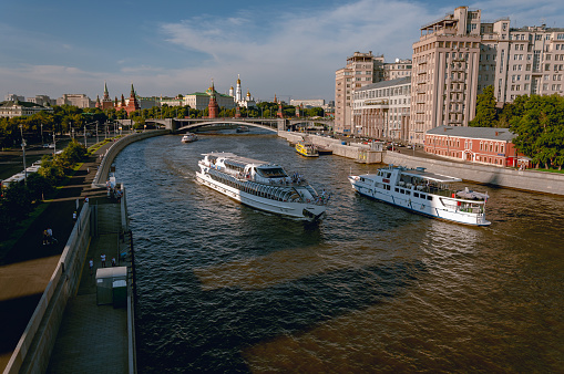 Moscow, Russia - June 26, 2016: City center with Moscow river, the boats, and historical buildings on the embankment