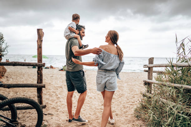 istock family on the beach with son 1329105612