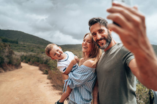 istock happy bikers family take a selfie 1329106318