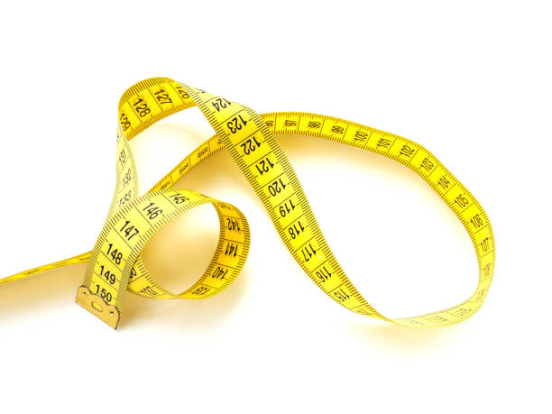 istock Yellow measuring tape isolated on white background 1329111501