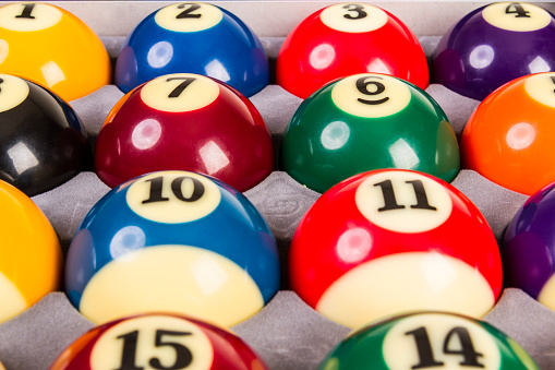 Top view of a full set of billiards balls inside an box. Nobody