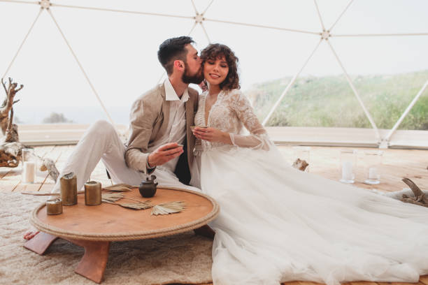 istock Tea ceremony at a boho wedding. Bride and groom in boho. 1329113279