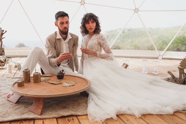 istock Tea ceremony at a boho wedding. Bride and groom in boho. 1329113298
